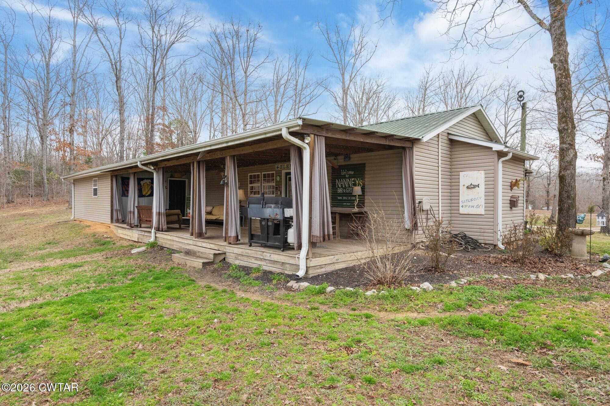 2108 Bohannon Landing Road Sugar Tree, TN 38380 - Photo 41 of 57 a view of a house with backyard and porch