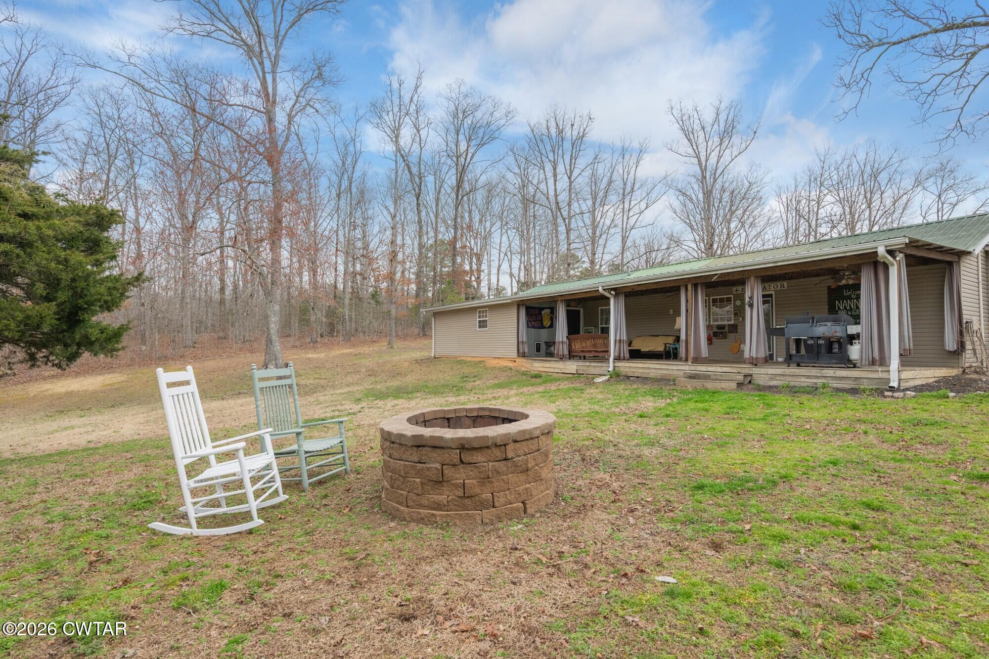 2108 Bohannon Landing Road Sugar Tree, TN 38380 - Photo 42 of 57 a view of a house with a yard and sitting area