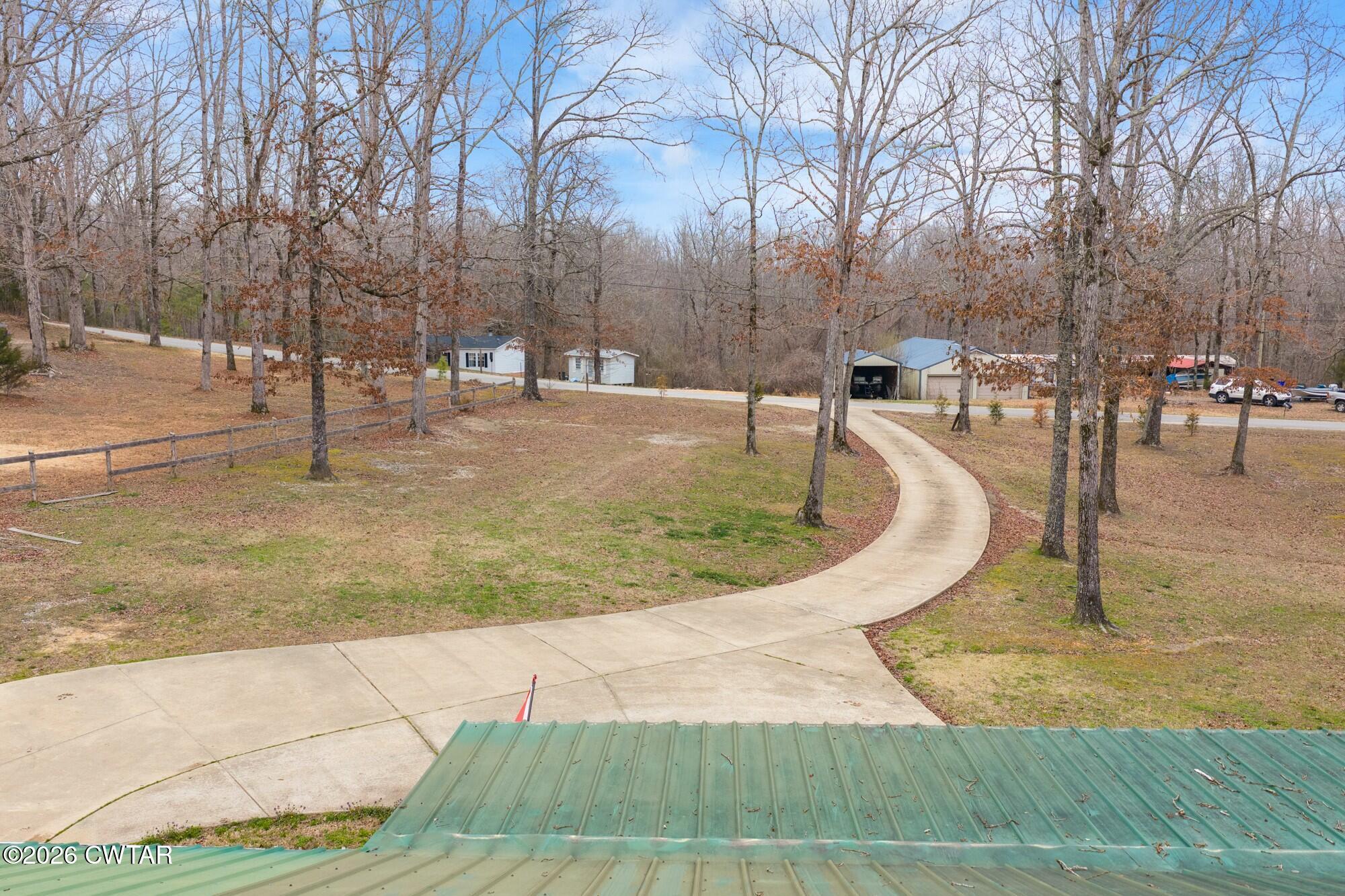 2108 Bohannon Landing Road Sugar Tree, TN 38380 - Photo 45 of 57 a swimming pool with outdoor seating and yard