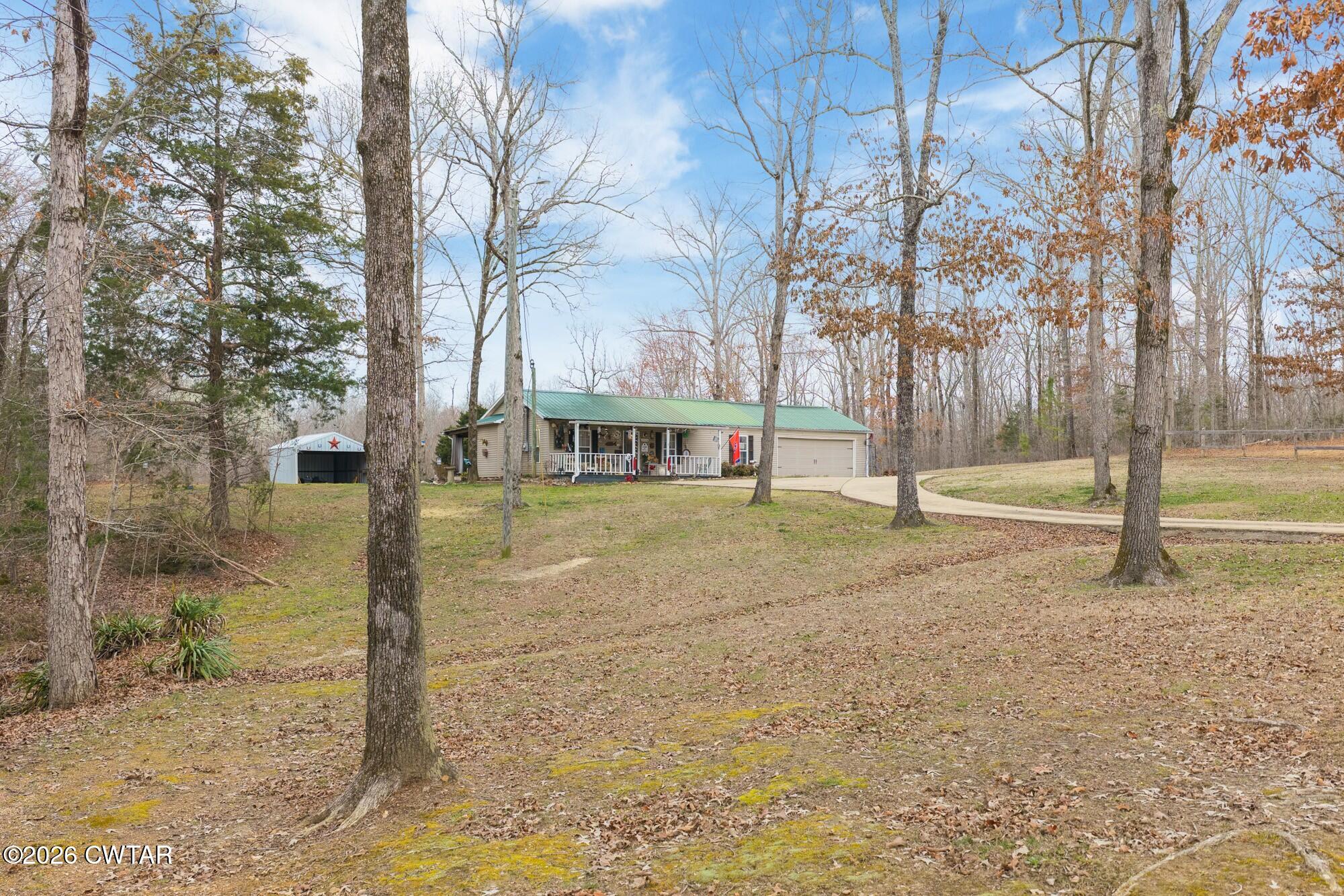 2108 Bohannon Landing Road Sugar Tree, TN 38380 - Photo 48 of 57 a front view of a house with a yard