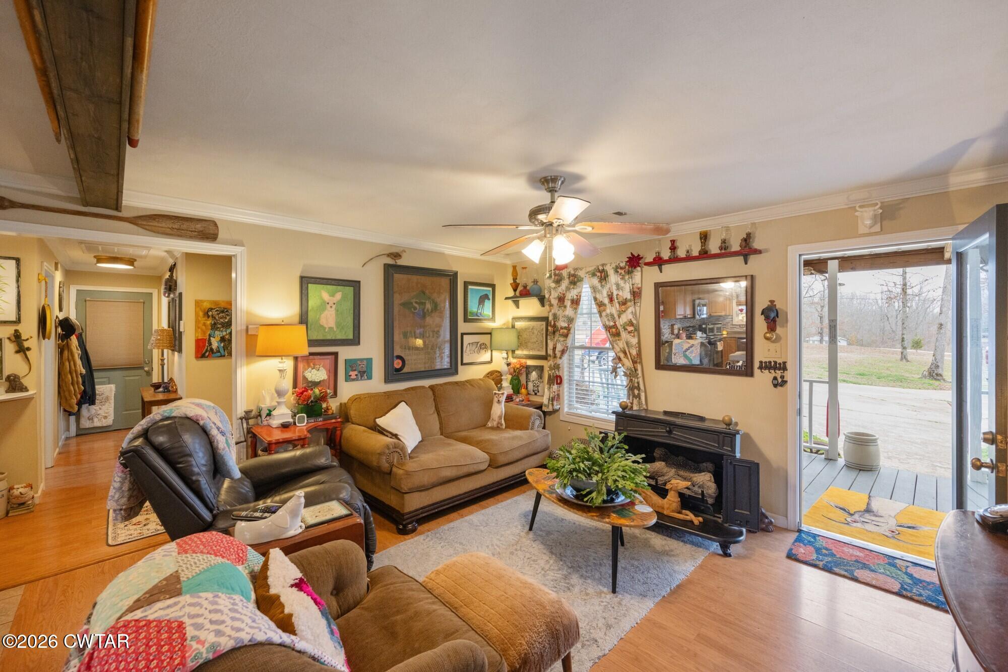 2108 Bohannon Landing Road Sugar Tree, TN 38380 - Photo 6 of 57 a living room with furniture and a chandelier