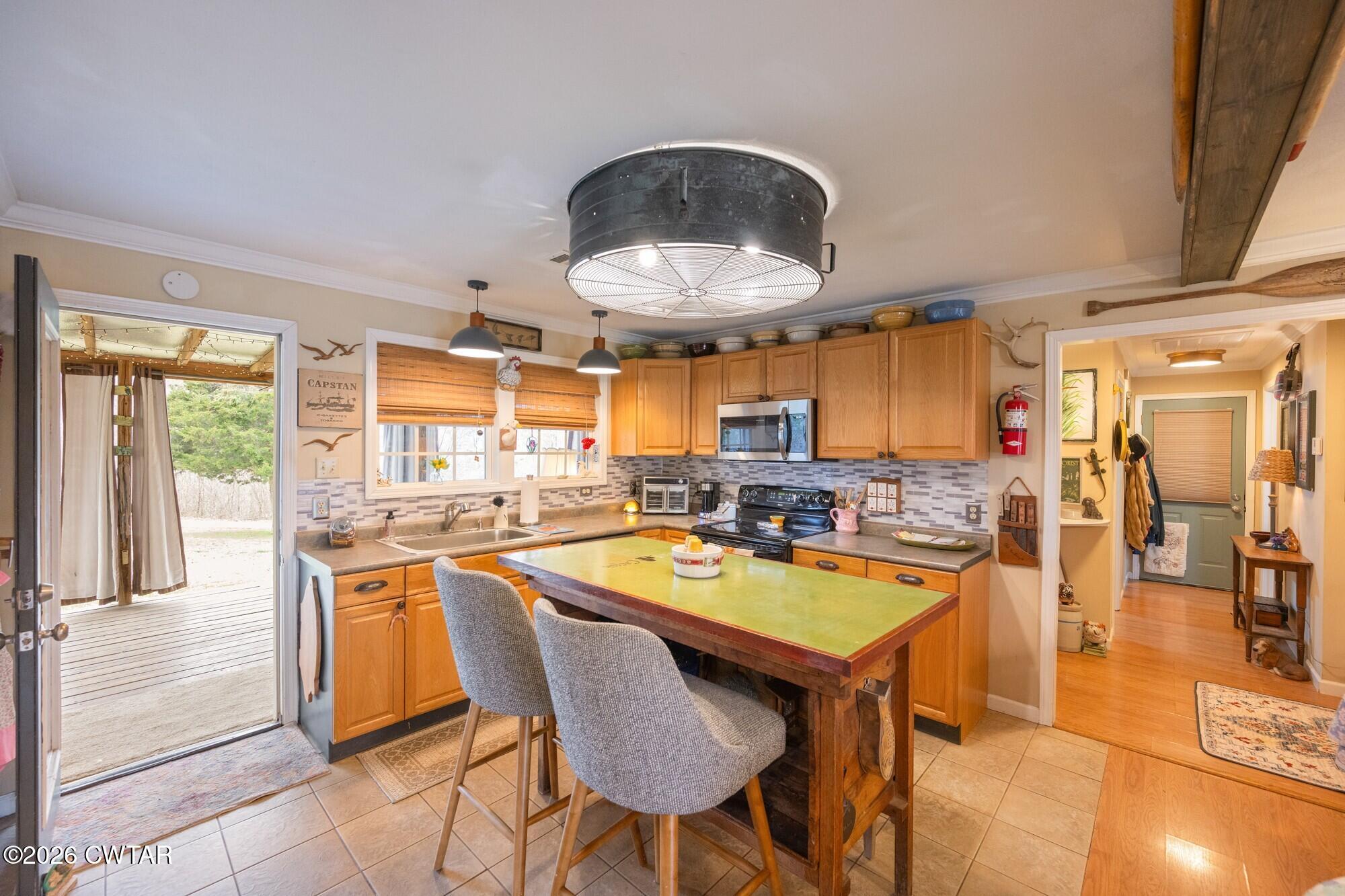 2108 Bohannon Landing Road Sugar Tree, TN 38380 - Photo 7 of 57 a kitchen with a table and chairs