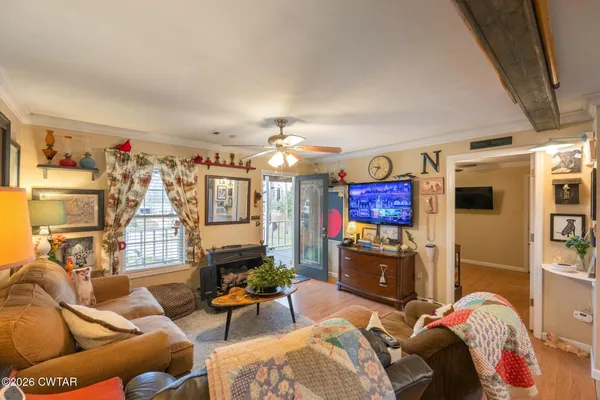a view of a livingroom with furniture and front door