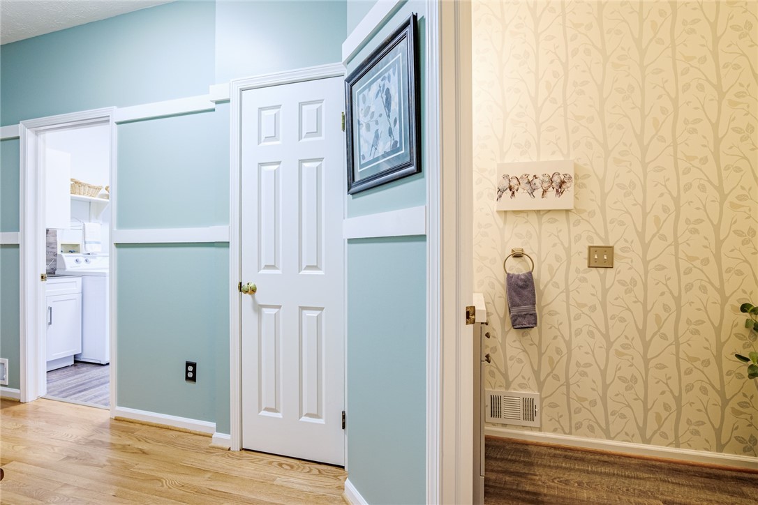 31 St Ebba's Drive Penfield, NY 14526 - Photo 21 of 49 1st floor hallway, taking you to the powder room!