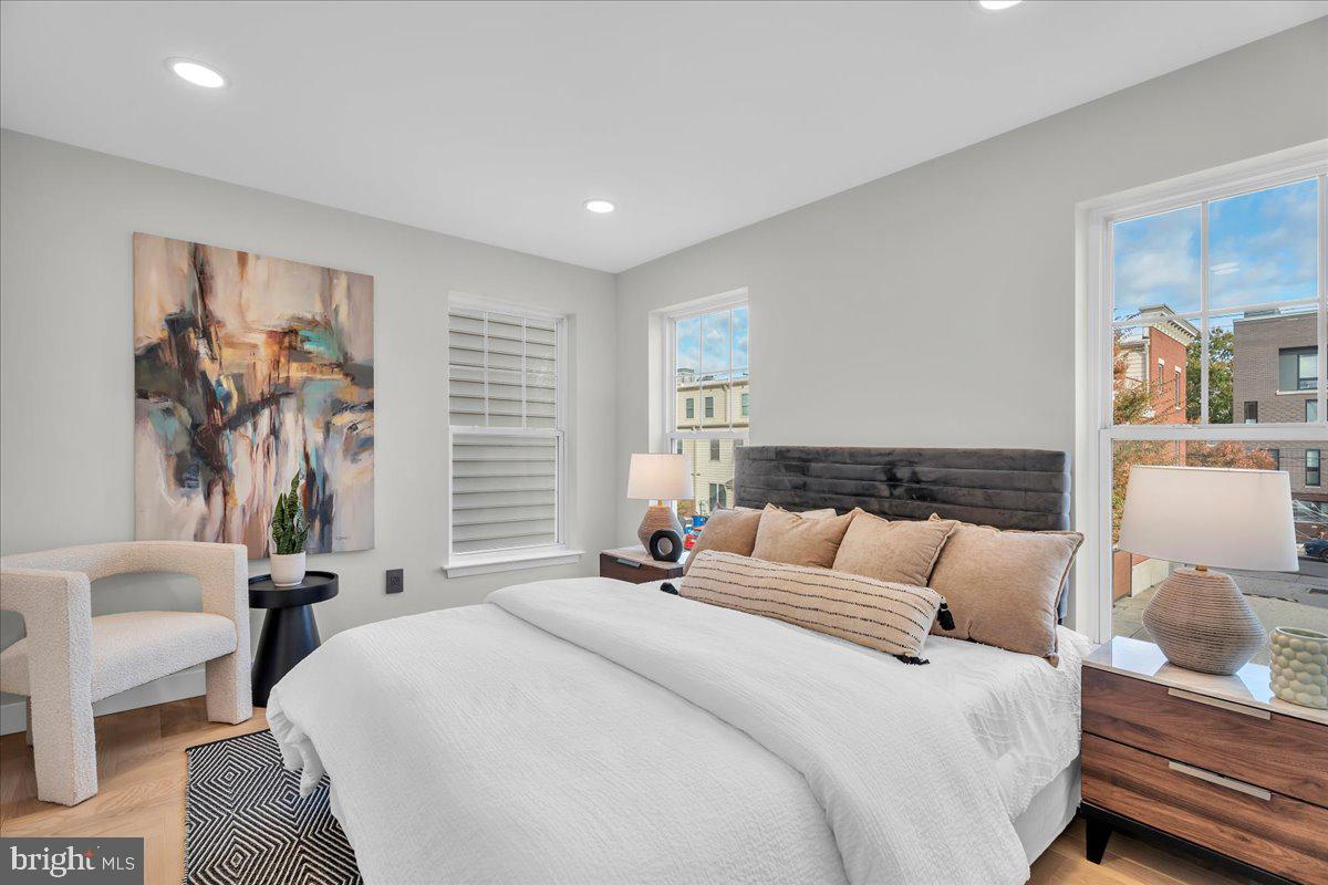 1227 Clymer Street Philadelphia, PA 19147 - Photo 16 of 37 a bedroom with a bed and a couch