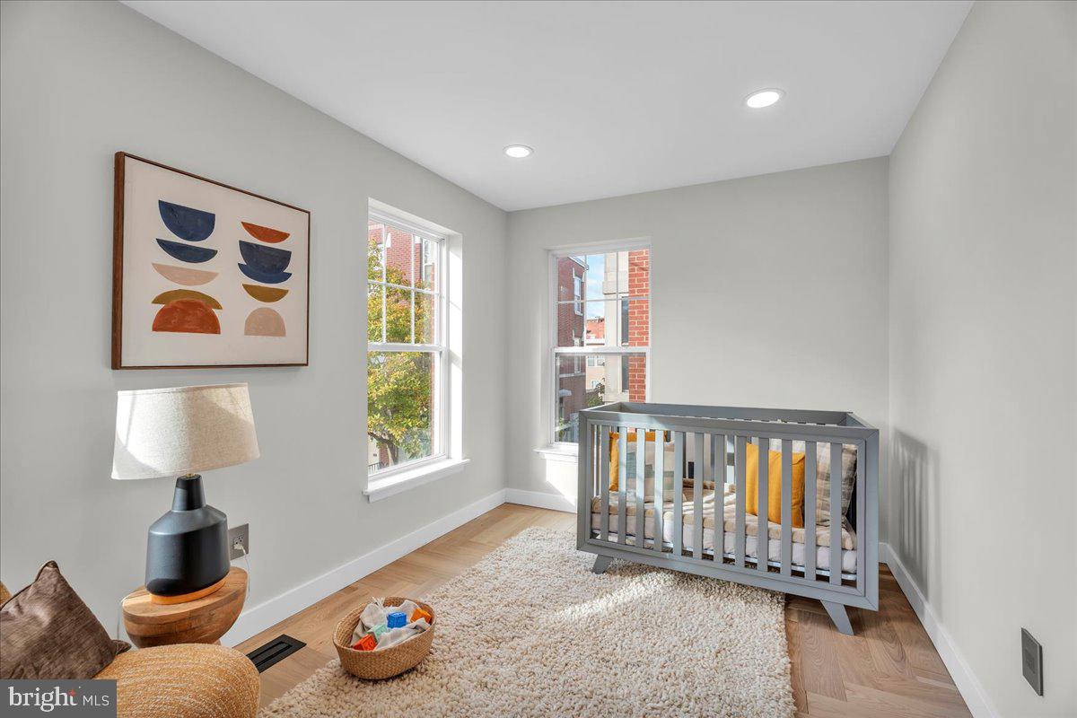 1227 Clymer Street Philadelphia, PA 19147 - Photo 19 of 37 a bedroom with furniture and a window
