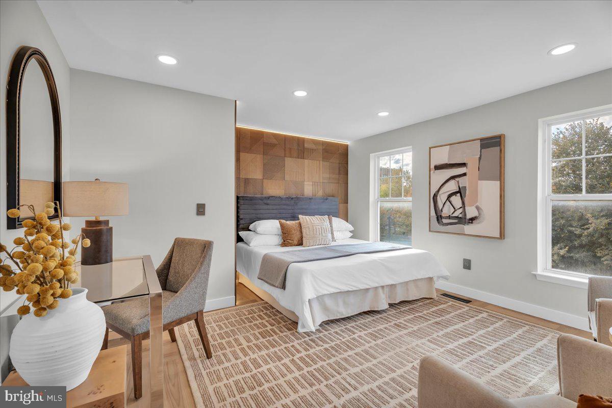 1227 Clymer Street Philadelphia, PA 19147 - Photo 23 of 37 a bed room with a bed and a chair