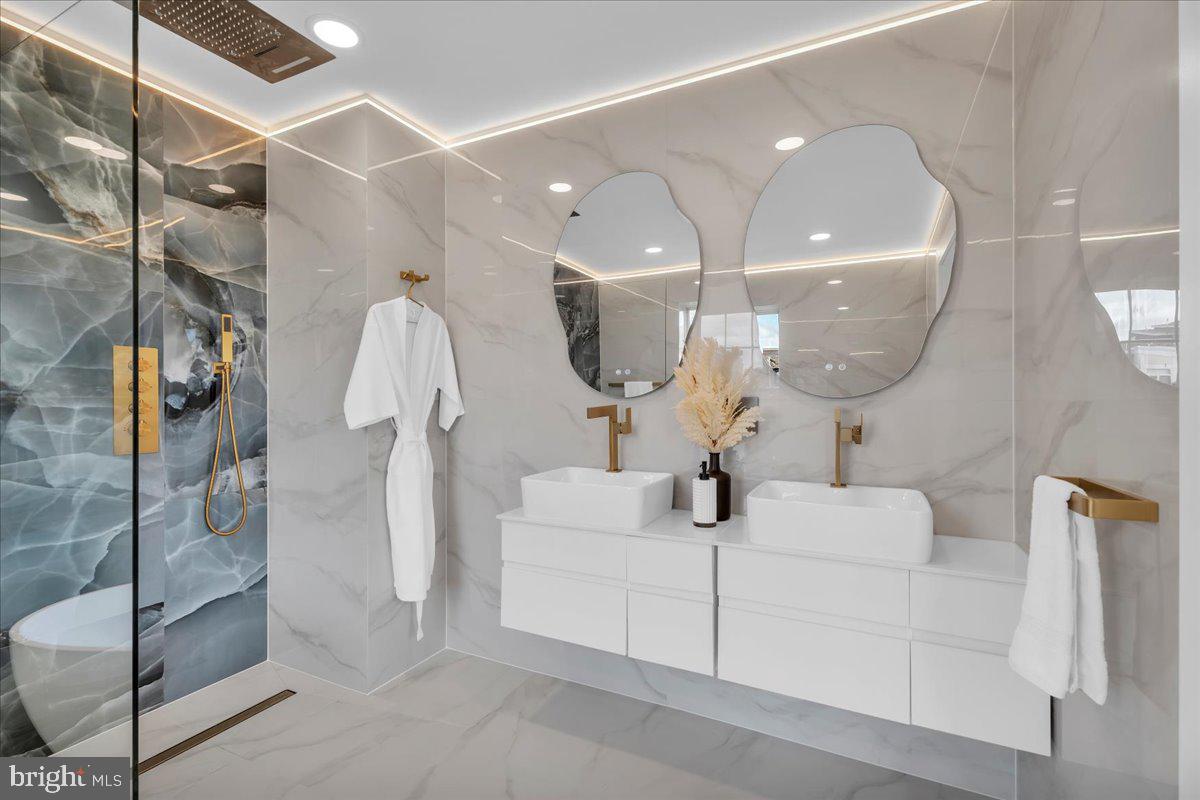 1227 Clymer Street Philadelphia, PA 19147 - Photo 25 of 37 a bathroom with a sink and mirror