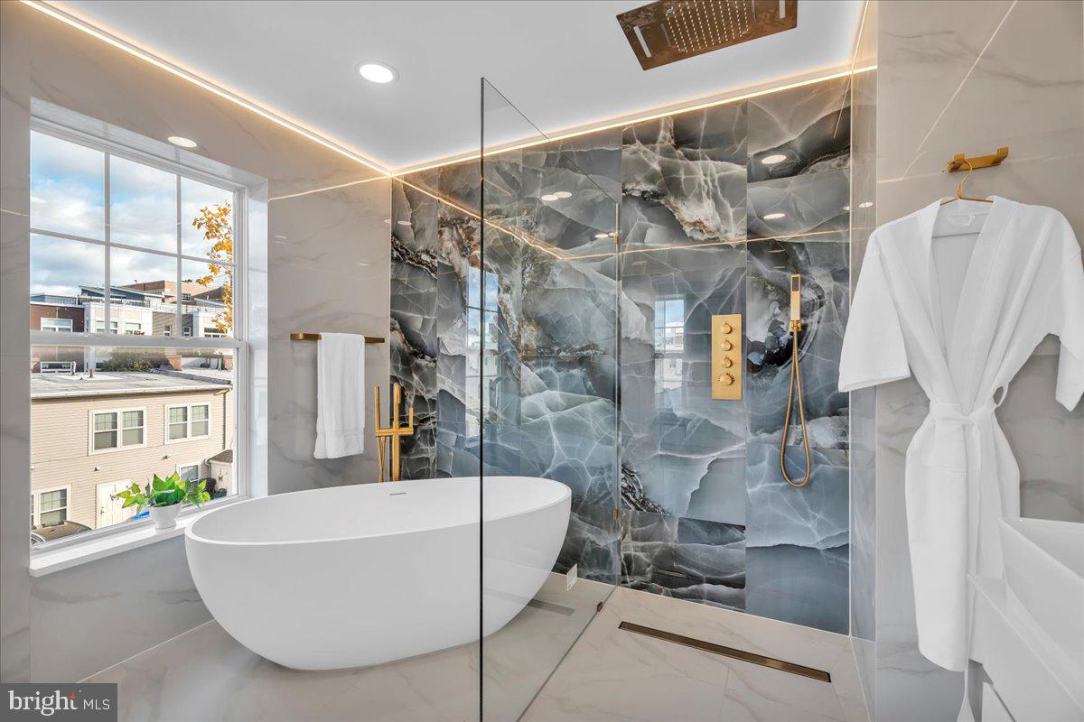 1227 Clymer Street Philadelphia, PA 19147 - Photo 26 of 37 a bathroom with a bathtub and shower