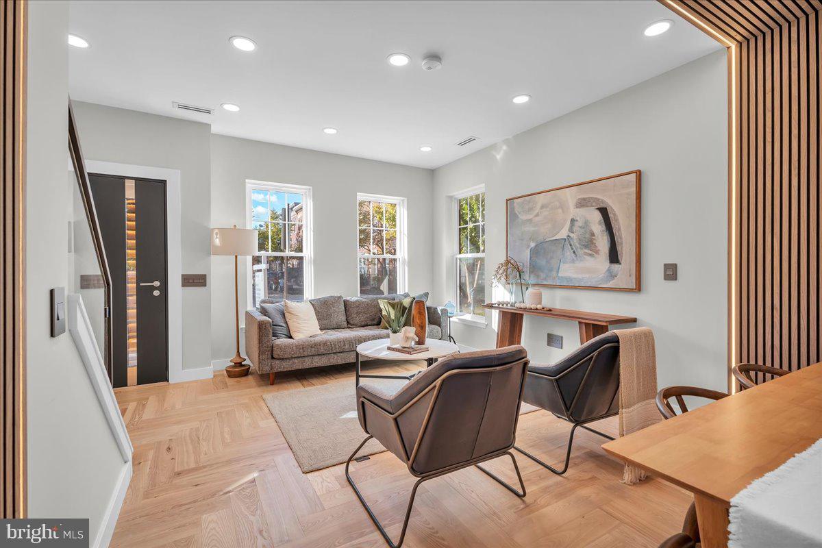 1227 Clymer Street Philadelphia, PA 19147 - Photo 4 of 37 a living room with furniture a large window and a wooden floor