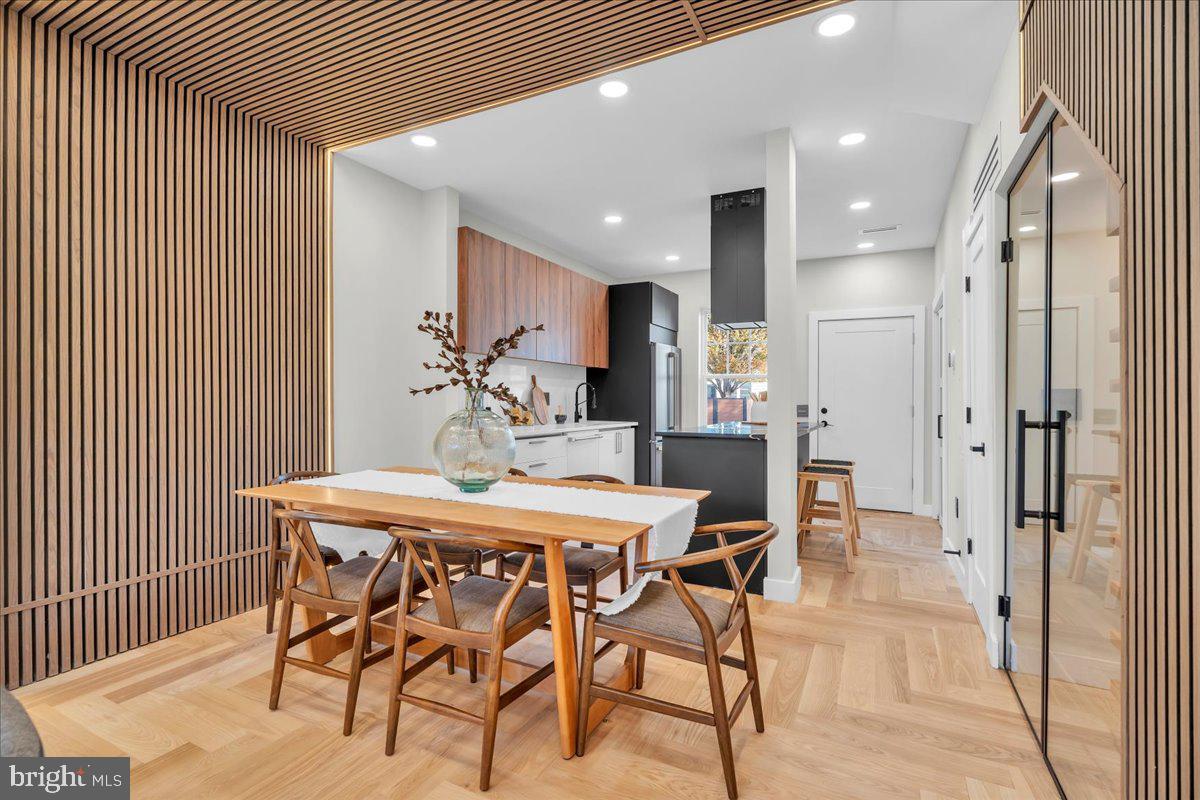 1227 Clymer Street Philadelphia, PA 19147 - Photo 7 of 37 a dining area with a table chairs and a kitchen view