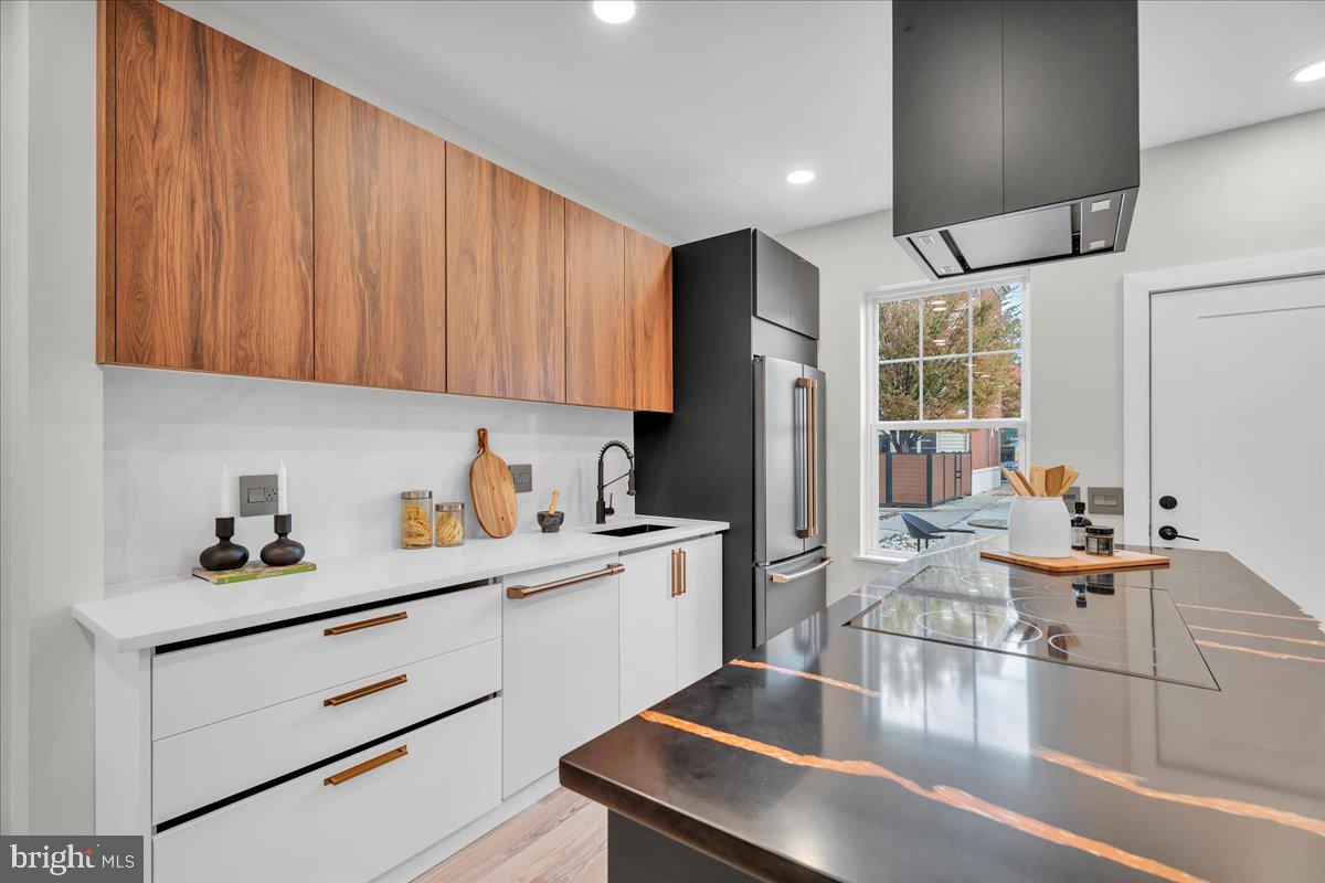 1227 Clymer Street Philadelphia, PA 19147 - Photo 9 of 37 a kitchen with a sink appliances and cabinets