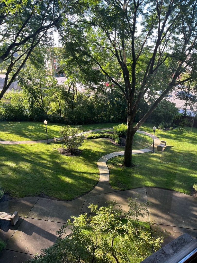 711 South River Road, Unit 401 Des Plaines, IL 60016 - Photo 22 of 22 a view of a golf course with a lake view
