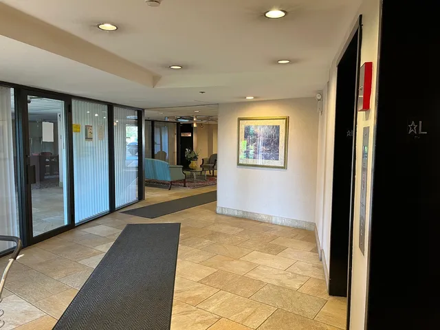 a view of hallway with living room and a window