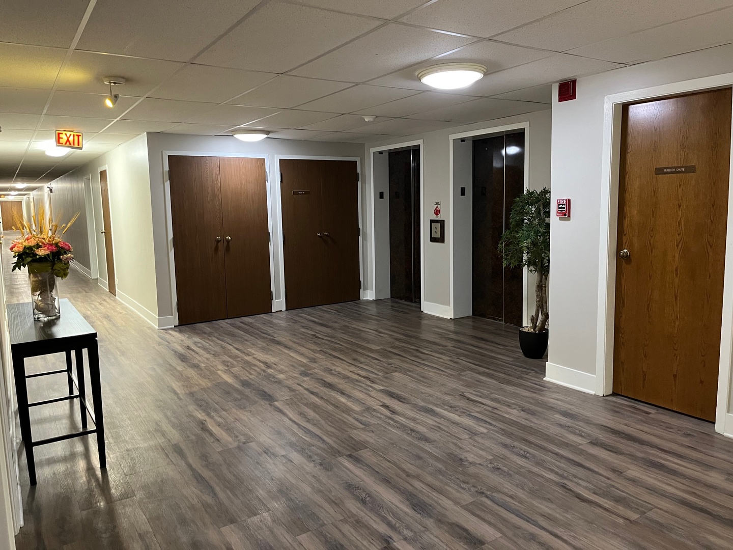 711 South River Road, Unit 401 Des Plaines, IL 60016 - Photo 8 of 22 a view of hallway with wooden floor