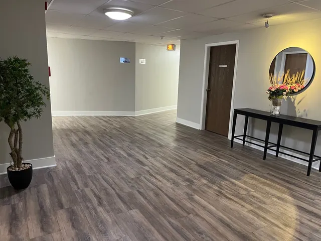 a view of a livingroom with furniture and wooden floor