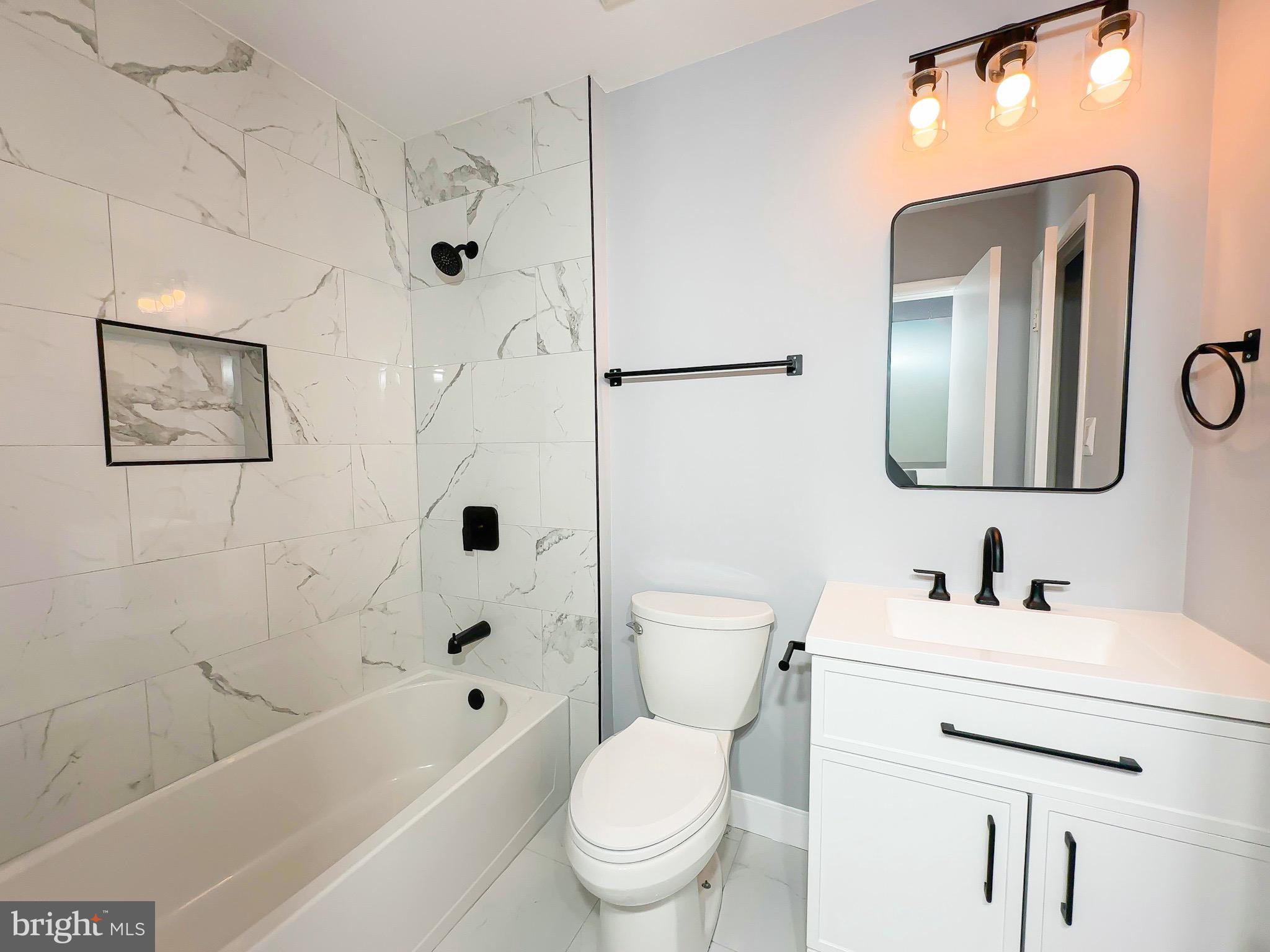 10167 Scotch Hill Drive, Unit 283 Upper Marlboro, MD 20774 - Photo 14 of 22 a bathroom with a toilet sink and a bathtub