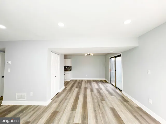 a view of a kitchen with a sink and cabinets
