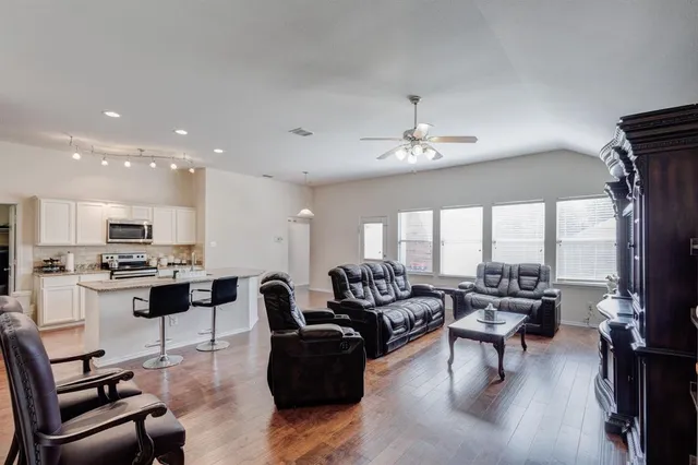 a living room with furniture and a large window