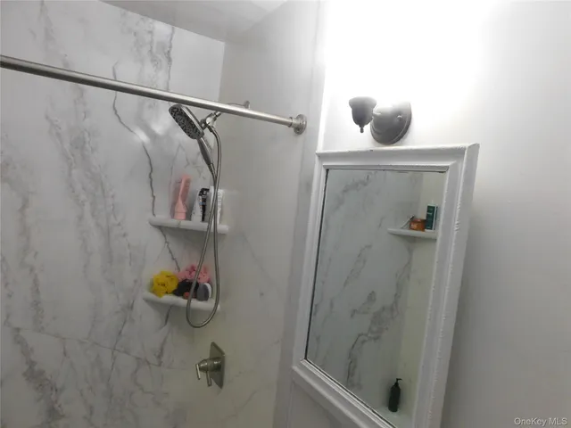 a bathroom with a sink a toilet and bathtub