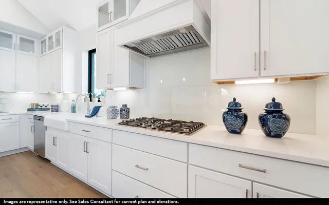 a kitchen with sink and cabinets