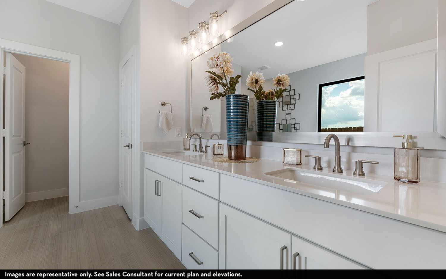 7910 Jasper Meadows Angleton, TX 77515 - Photo 19 of 31 a bathroom with double vanity and a mirror