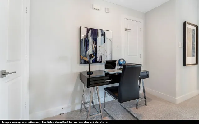 a view of a workspace with furniture