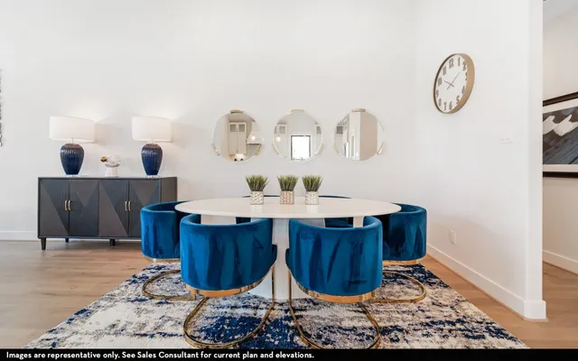 a dining room with table and chairs