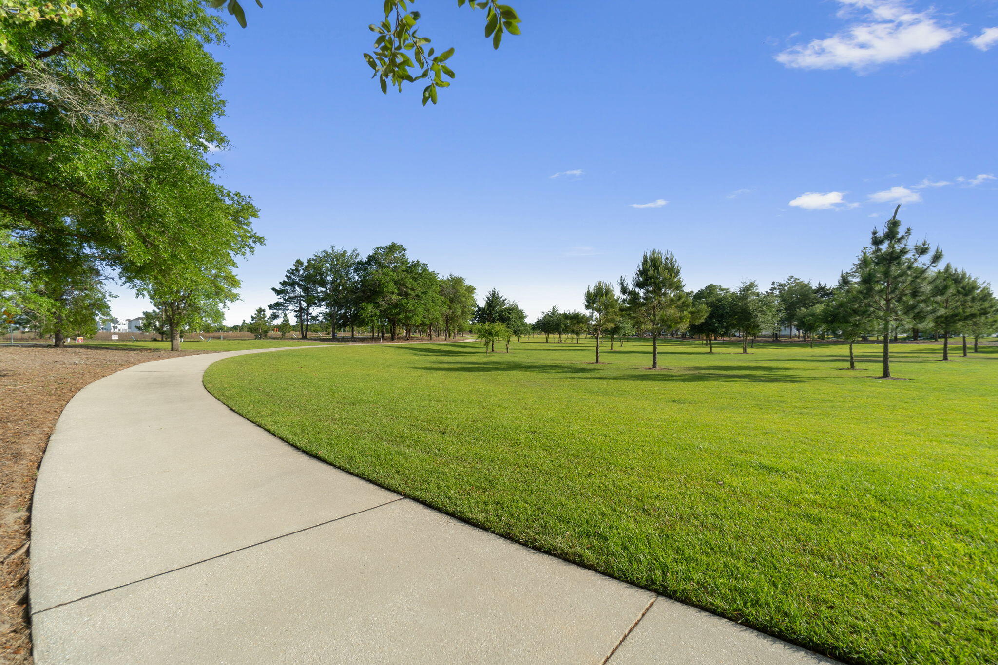 195 Sweetclover Street Freeport, FL 32439 - Photo 15 of 19 a view of a golf course with a lake