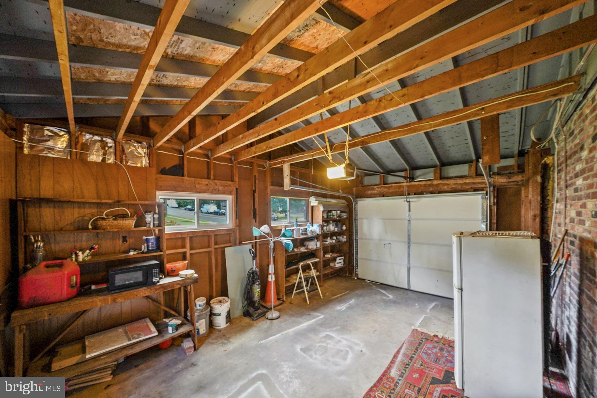 4128 Roberts Road Fairfax, VA 22032 - Photo 53 of 54 Spacious Single Car Garage with Exposed Brick Wall