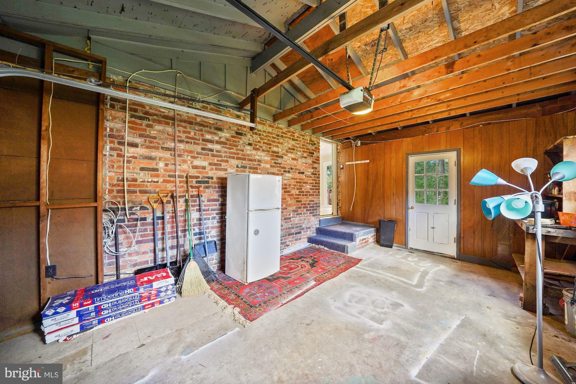 4128 Roberts Road Fairfax, VA 22032 - Photo 54 of 54 Spacious Single Car Garage with Exposed Brick Wall
