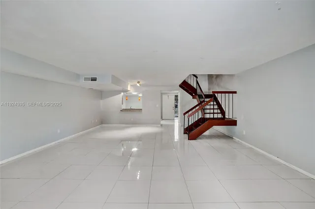 a view of a hallway with windows