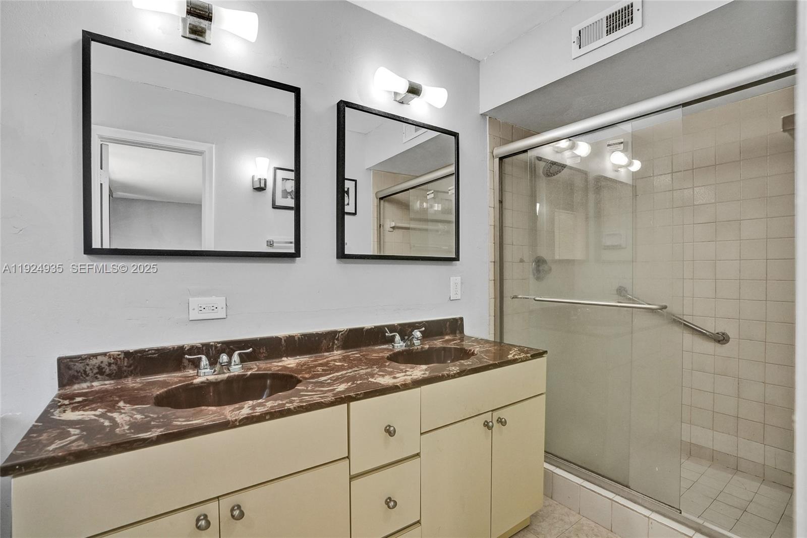 20607 Northeast 7th Court Miami, FL 33179 - Photo 23 of 49 a bathroom with a sink and a mirror