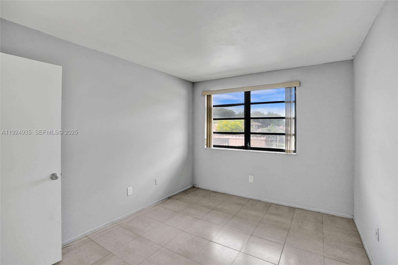20607 Northeast 7th Court Miami, FL 33179 - Photo 31 of 49 a view of an empty room with a window