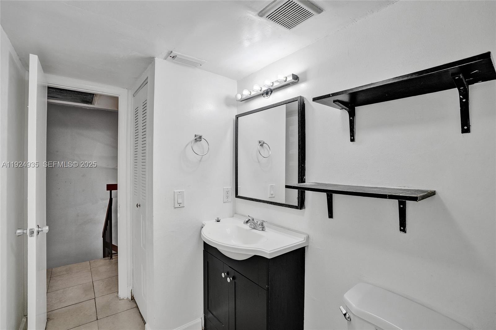 20607 Northeast 7th Court Miami, FL 33179 - Photo 36 of 49 a bathroom with a sink toilet and shower