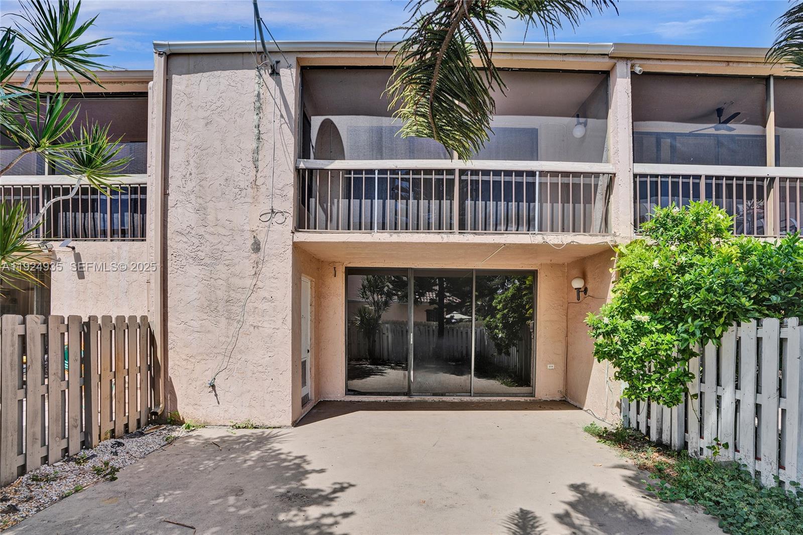 20607 Northeast 7th Court Miami, FL 33179 - Photo 47 of 49 a view of front door and potted plants