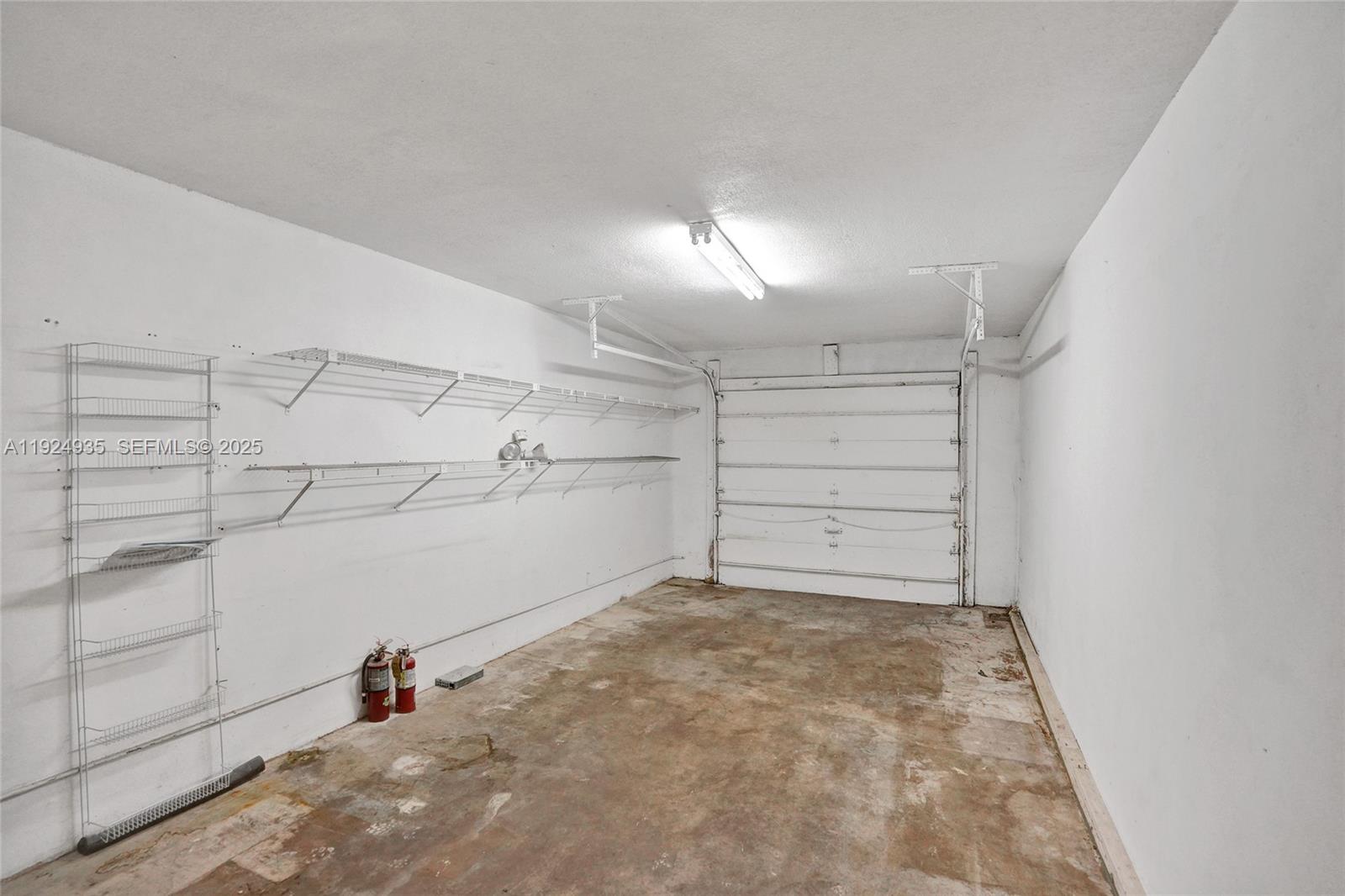 20607 Northeast 7th Court Miami, FL 33179 - Photo 49 of 49 a view of a room with racks on the wall