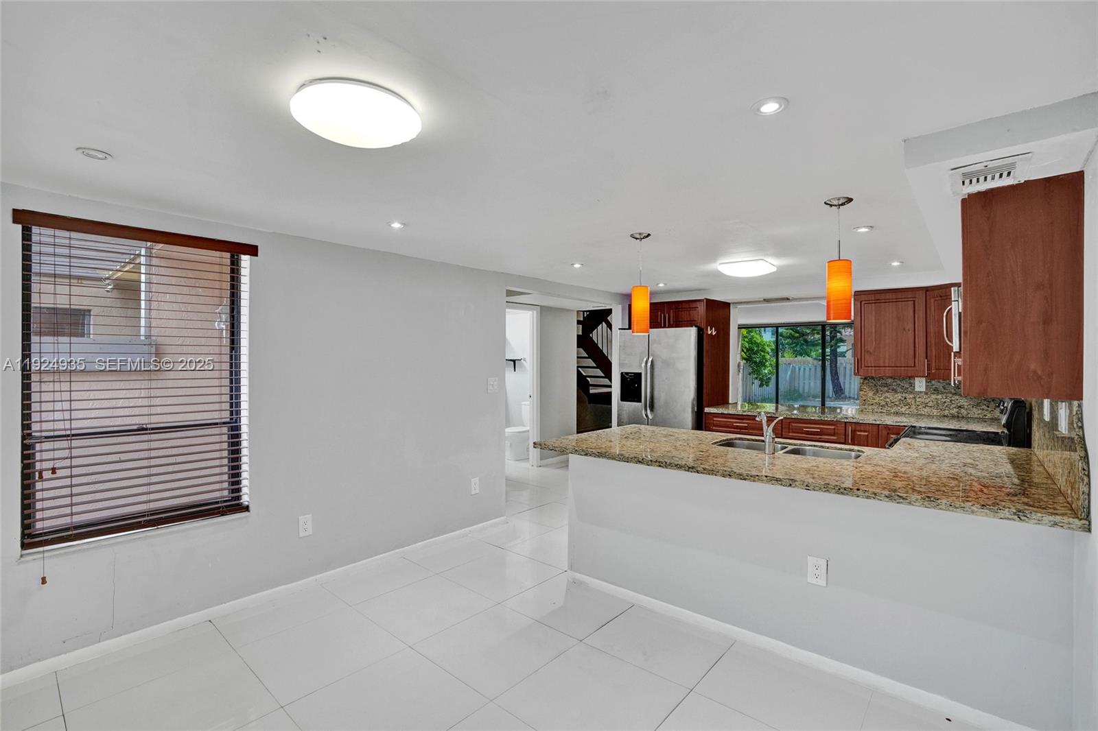 20607 Northeast 7th Court Miami, FL 33179 - Photo 10 of 49 a view of a kitchen with a sink and a large window