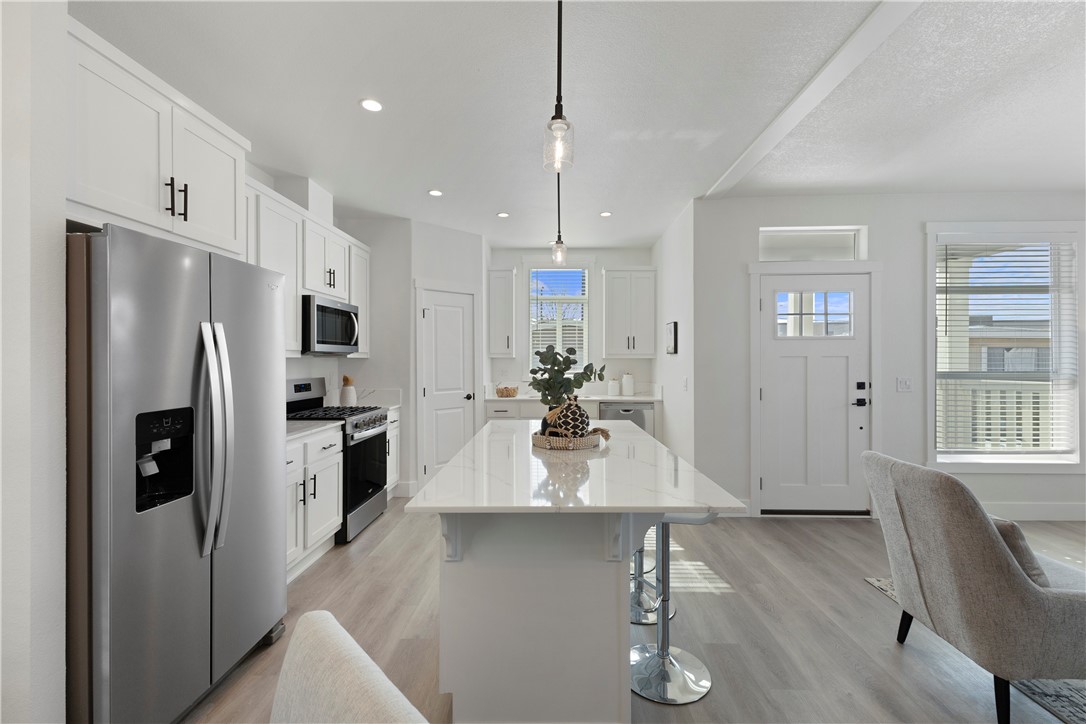 2139 East 4th Street, Unit 244 Ontario, CA 91764 - Photo 4 of 19 Kitchen island with lots of cabinet space