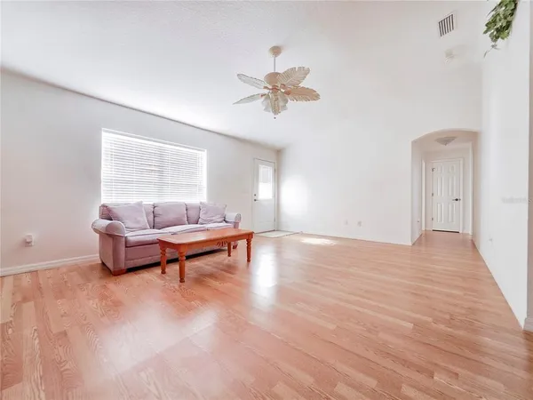 a living room with furniture and a large window
