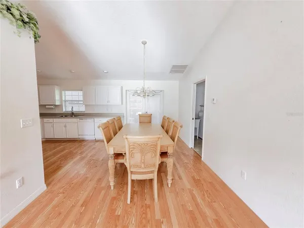 a view of a dining room with furniture and window