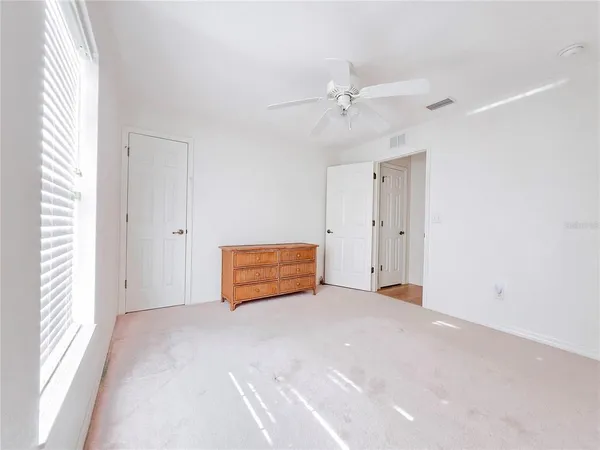 a bathroom with a sink a bathtub and a window