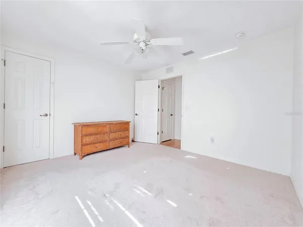 a white toilet sitting next to a bath tub