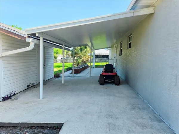 a view of a house with a yard and a garden
