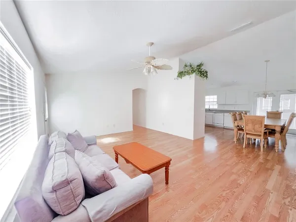 a view of a dining room with furniture and wooden floor