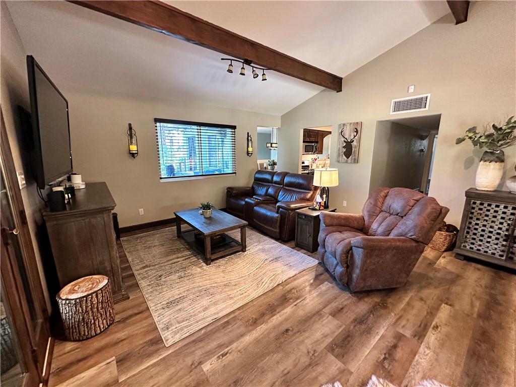 6615 Flag Mine Road Kingman, AZ 86401 - Photo 13 of 72 a living room with furniture and a flat screen tv