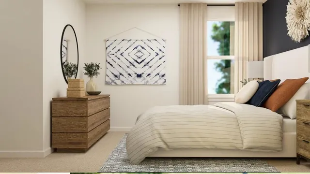 a bedroom with a bed and a mirror