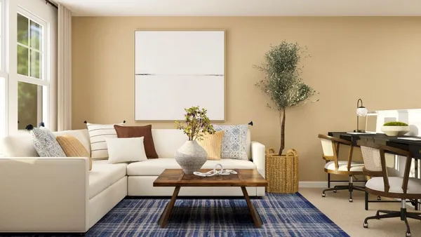 a living room with furniture and a table