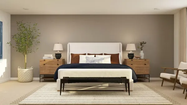 a bedroom with a bed and a table