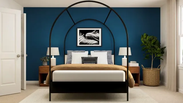 a bedroom with a bed and potted plant